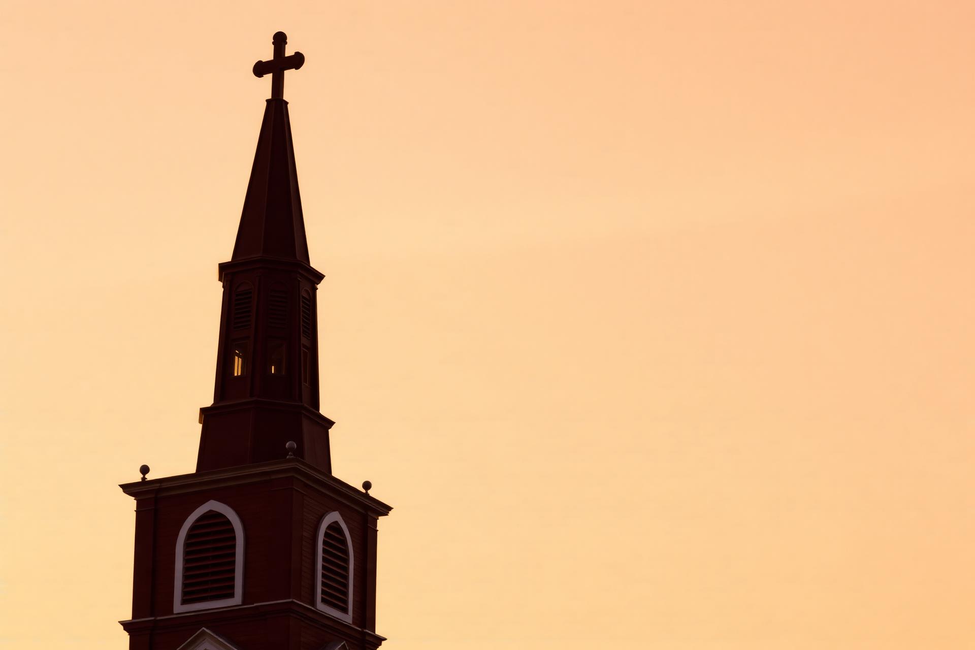 Historic church steeple at golden hour